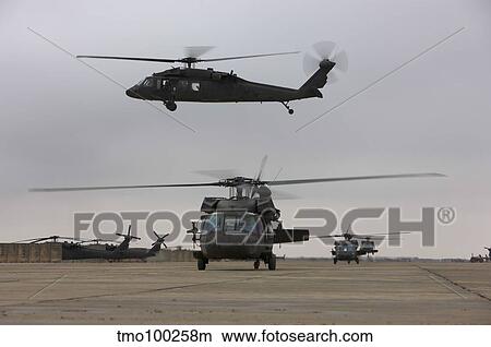 UH-60 Black Hawks taxis out for a mission over northern Iraq. View Large Photo Image Picture - UH-60 Black Hawks taxis out for a mission over northern Iraq.. Fotosearch