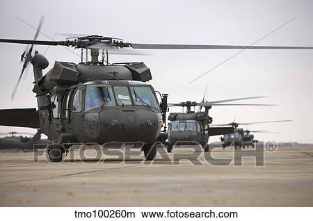 UH-60 Black Hawks taxis out for a mission over northern Iraq. View Large Photo Image Picture - UH-60 Black Hawks taxis out for a mission over northern Iraq.. Fotosearch