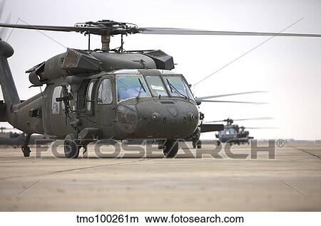 UH-60 Black Hawks taxis out for a mission over northern Iraq. View Large Photo Image Picture - UH-60 Black Hawks taxis out for a mission over northern Iraq.. Fotosearch