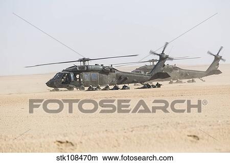 UH-60 Blackhawk helicopters air drop soldiers in Kuwait. View Large Photo Image Picture - UH-60 Blackhawk helicopters air drop soldiers in Kuwait.. Fotosearch