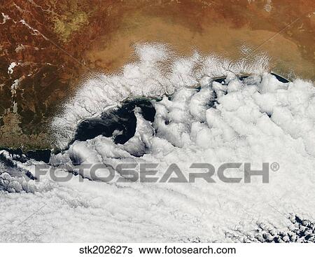 Unusual cloud formations crowd the coastline of Australia. View Large Photo Image Stock Photograph - Unusual cloud formations crowd the coastline of Australia.. Fotosearch