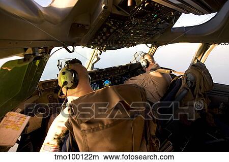 US Army Pilots in-flight in the cockpit of a C-17 Globemaster III during a mission to Qatar. View Large Photo Image Picture - US Army Pilots in-flight in the cockpit of a C-17 Globemaster III during a mission to Qatar.. Fotosearch