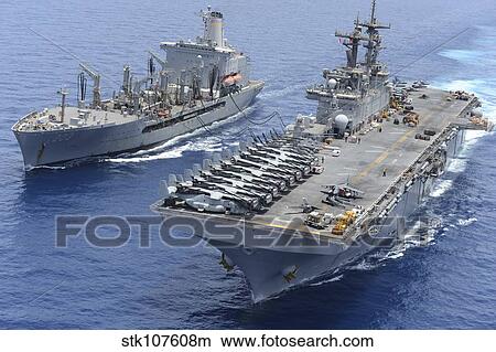 USNS Laramie an USS Kearsarge conduct a replenishment at sea. View Large Photo Image Picture - USNS Laramie an USS Kearsarge conduct a replenishment at sea.. Fotosearch