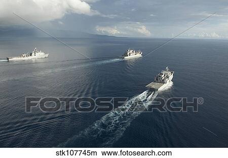 Picture - USNS Matthew Perry, USS Pearl Harbor and HMNZS Canterbury transit the Vella Gulf.. Fotosearch