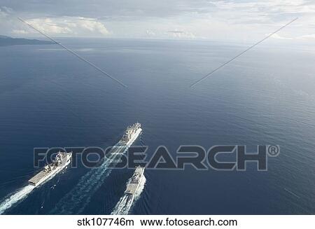 Picture - USNS Matthew Perry, USS Pearl Harbor and HMNZS Canterbury transit the Vella Gulf.. Fotosearch
