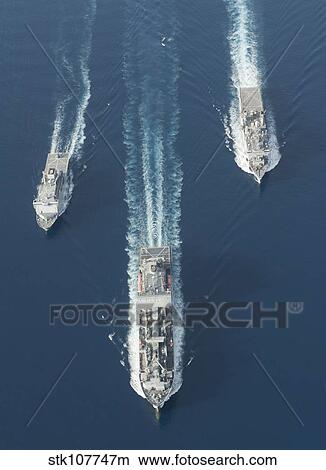 Picture - USNS Matthew Perry, USS Pearl Harbor and HMNZS Canterbury transit the Vella Gulf.. Fotosearch