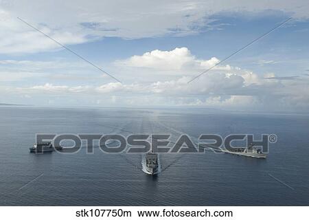 Picture - USNS Matthew Perry, USS Pearl Harbor and HMNZS Canterbury transit the Vella Gulf.. Fotosearch