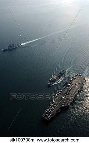 USNS Saturn conducts a vertical replenishment at sea with USS Harry S. Truman and USS Monterey. View Large Photo Image Picture - USNS Saturn conducts a vertical replenishment at sea with USS Harry S. Truman and USS Monterey.. Fotosearch