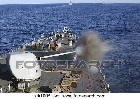 USS Barry fires her forward mounted Mk-45/5' 54 caliber lightweight gun. View Large Photo Image Picture - USS Barry fires her forward mounted Mk-45/5' 54 caliber lightweight gun.. Fotosearch