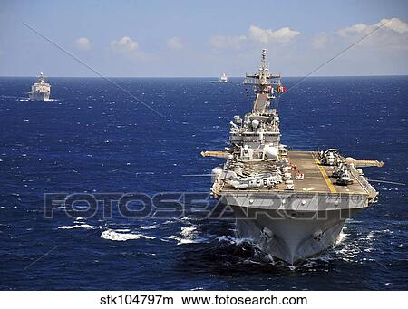 USS Boxer leads a convoy of ships in the Indian Ocean. View Large Photo Image Picture - USS Boxer leads a convoy of ships in the Indian Ocean.. Fotosearch