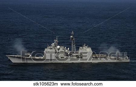 USS Bunker Hill fires two MK-45 5 inch/54-caliber lightweight guns. View Large Photo Image Picture - USS Bunker Hill fires two MK-45 5 inch/54-caliber lightweight guns.. Fotosearch