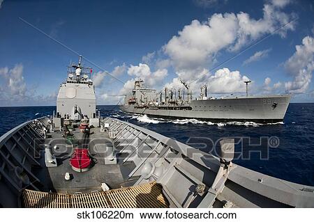 USS Cowpens transits alongside USNS Tippecanoe. View Large Photo Image Picture - USS Cowpens transits alongside USNS Tippecanoe.. Fotosearch