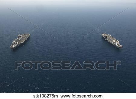 USS George H. W. Bush transits alongside USS Harry S. Truman. View Large Photo Image Picture - USS George H. W. Bush transits alongside USS Harry S. Truman.. Fotosearch