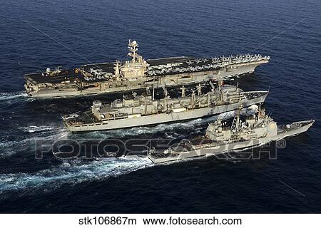 USS John C. Stennis, USS Mobile Bay and USNS Bridge during a replenishment at sea. View Large Photo Image Picture - USS John C. Stennis, USS Mobile Bay and USNS Bridge during a replenishment at sea.. Fotosearch