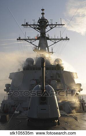USS Mitscher conducts a test of its countermeasure wash down system. View Large Photo Image Picture - USS Mitscher conducts a test of its countermeasure wash down system.. Fotosearch