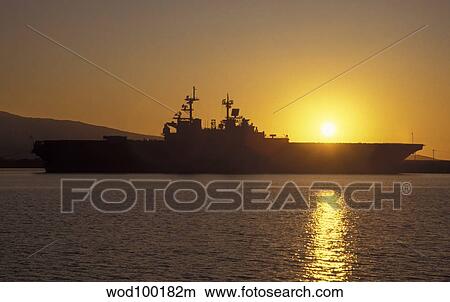 USS Tarawa pierside as the sun sets off Korea. View Large Photo Image Picture - USS Tarawa pierside as the sun sets off Korea.. Fotosearch