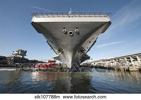 USS Theodore Roosevelt pulls out of Newport News Shipyard. View Large Photo Image Picture - USS Theodore Roosevelt pulls out of Newport News Shipyard.. Fotosearch