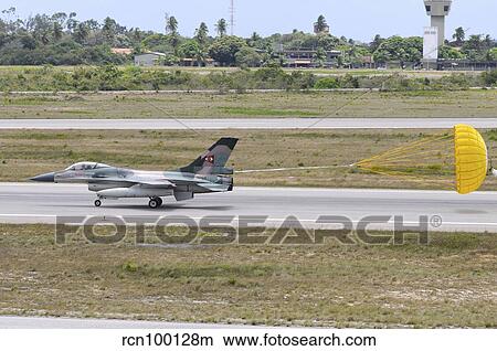 Venezuelan Air Force F-16 landing with parachute brake deployed. View Large Photo Image Picture - Venezuelan Air Force F-16 landing with parachute brake deployed.. Fotosearch