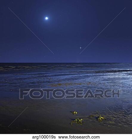 Venus shines brightly below the crescent Moon from coast of Buenos Aires, Argentina. View Large Photo Image Stock Photograph - Venus shines brightly below the crescent Moon from coast of Buenos Aires, Argentina.. Fotosearch