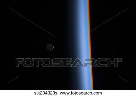 View of a crescent moon rising and the cusp of Earth's atmosphere. View Large Photo Image Stock Photograph - View of a crescent moon rising and the cusp of Earth's atmosphere.. Fotosearch