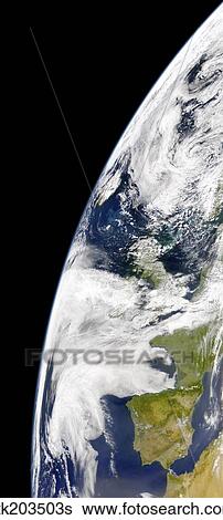 Stock Photograph - View of Earth from space showing phytoplankton bloom between Iceland and the United Kingdom.. Fotosearch