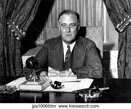 Picture - Vintage World War Two photo of President Franklin Delano Roosevelt sitting at his desk.. Fotosearch