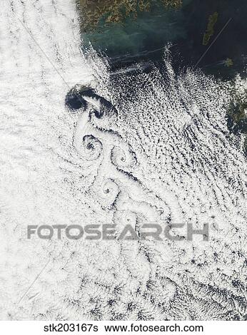 Von Karmann cloud vortices off the coast of Cheju Do. View Large Photo Image Stock Photograph - Von Karmann cloud vortices off the coast of Cheju Do.. Fotosearch