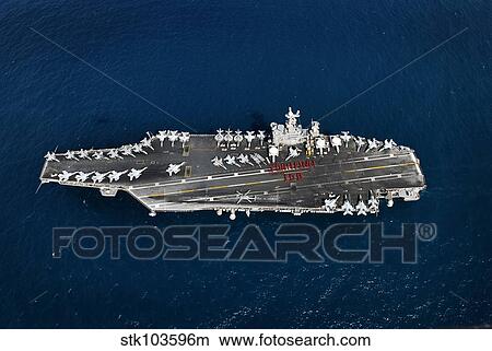 Picture - Weapons department personnel on the flight deck of the aircraft carrier USS John C. Stennis.. Fotosearch