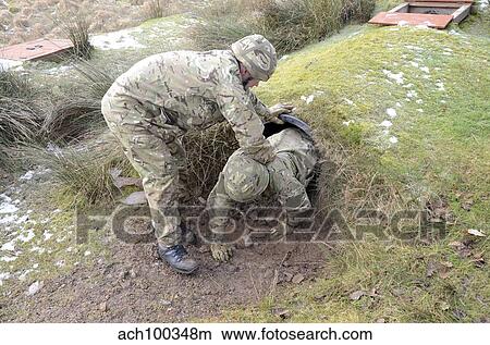 Welsh Guards perform basic training on the assault course at Sennybridge Training Area. View Large Photo Image Picture - Welsh Guards perform basic training on the assault course at Sennybridge Training Area.. Fotosearch