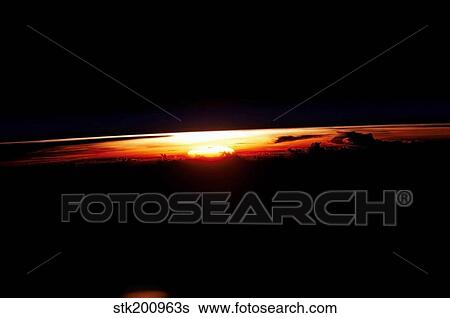 West-looking view featuring the profile of the atmosphere and the setting sun. View Large Photo Image Stock Photograph - West-looking view featuring the profile of the atmosphere and the setting sun.. Fotosearch