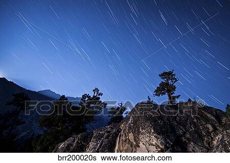 Whisps of moonlight shine through the mountain peaks of Inyo National Forest. View Large Photo Image Stock Photograph - Whisps of moonlight shine through the mountain peaks of Inyo National Forest.. Fotosearch