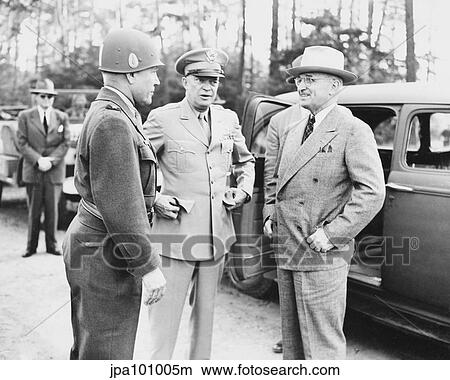 World War II photo of President Harry Truman talking to General Eisenhower and Hickey. View Large Photo Image Picture - World War II photo of President Harry Truman talking to General Eisenhower and Hickey.. Fotosearch