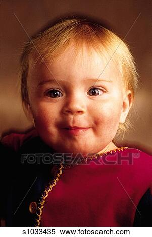 Baby Girl With Short Strawberry Blonde Hair And Big Blue Eyes