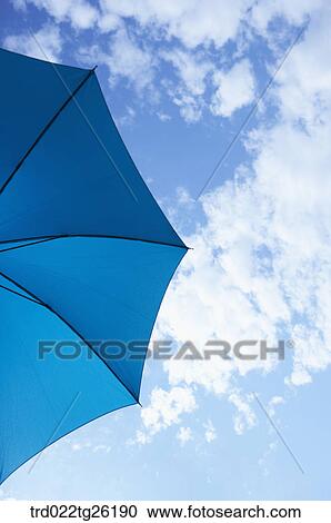 Clipart - blue umbrella with the blue sky. Fotosearch