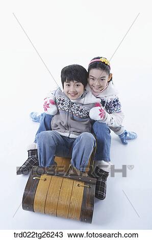 boy and girl go sleding View Large Illustration Drawing - boy and girl go sleding. Fotosearch