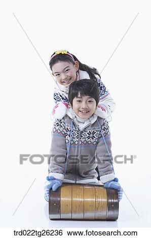 Stock Illustration - boy and girl go sleding. Fotosearch