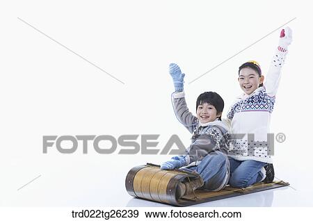 Stock Illustration - boy and girl go sleding. Fotosearch