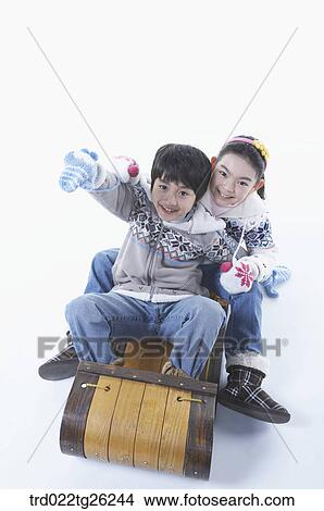 Stock Illustration - boy and girl go sleding. Fotosearch