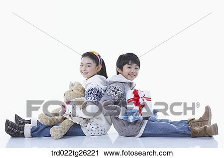 boy and girl got christmas present View Large Illustration Clip Art - boy and girl got christmas present. Fotosearch
