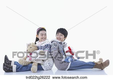 Drawing - boy and girl got christmas present. Fotosearch
