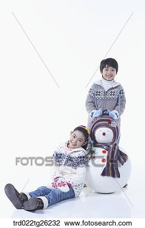 boy and girl with a snowman View Large Illustration Drawing - boy and girl with a snowman. Fotosearch