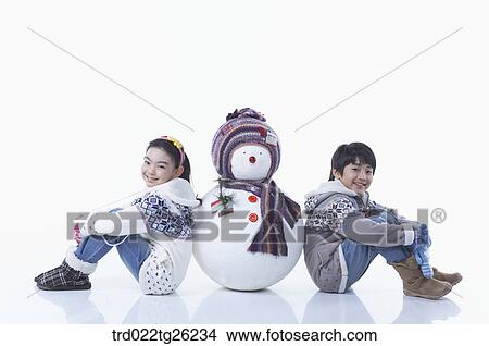 boy and girl with a snowman View Large Illustration Stock Illustration - boy and girl with a snowman. Fotosearch