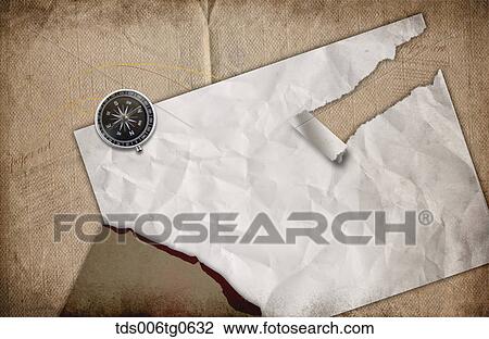 Drawing - compass and torn paper background. Fotosearch