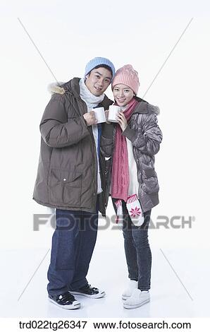 Stock Illustration - couple holding the mugs. Fotosearch