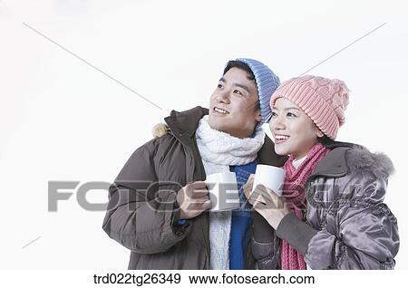 couple holding the mugs View Large Illustration Stock Illustration - couple holding the mugs. Fotosearch