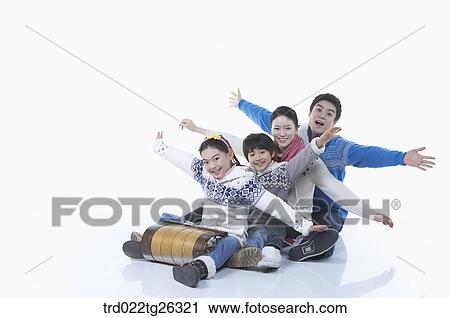 Clip Art - family go sleding and steretched out their arms. Fotosearch