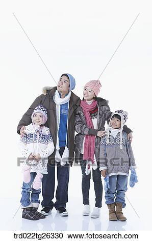 family wearing winter outfit and winter items View Large Illustration Clipart - family wearing winter outfit and winter items. Fotosearch