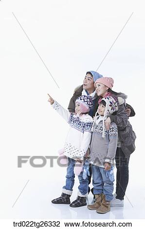 Drawing - family wearing winter outfit and winter items. Fotosearch