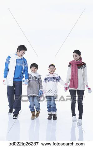 Stock Illustration - famliy is wearing winter goods with happy smile. Fotosearch