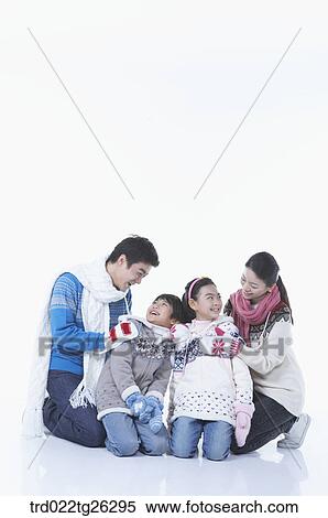 Stock Illustration - famliy kneel down in winter goods. Fotosearch